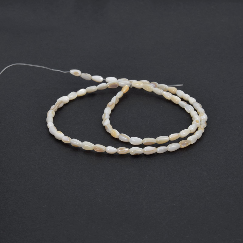 Намистини Перламутр бежевий, Натур. камінь, 5х3 мм, Крапля (BUS-058131)