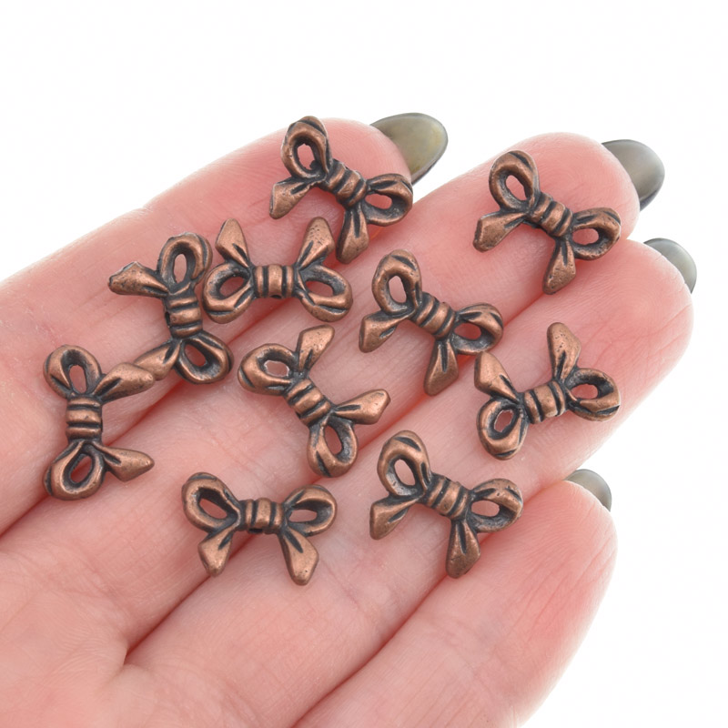 Намистини мет. Бантик, 14х10 мм, Мідь (BUS-009006)